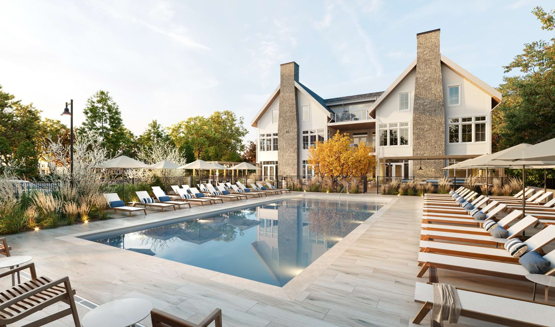 a swimming pool with chairs around it